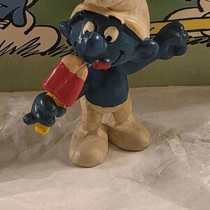 Blue and Cream Figurine with Red Popsicle